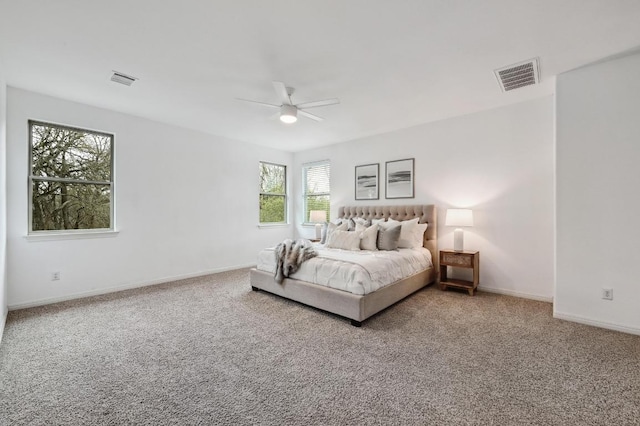 bedroom featuring a ceiling fan, baseboards, visible vents, and carpet flooring