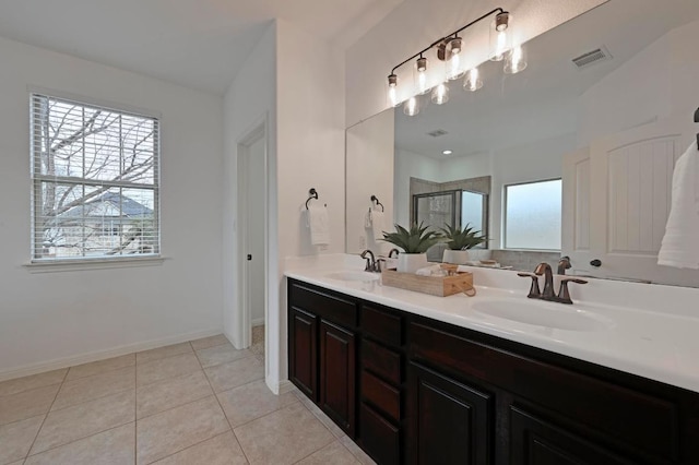 full bathroom with a stall shower, visible vents, a sink, and tile patterned floors