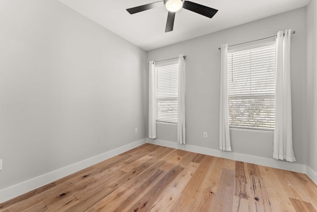 unfurnished bedroom featuring a ceiling fan, baseboards, and light wood finished floors