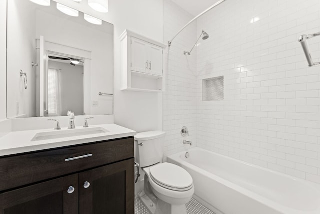 full bath featuring toilet, vanity, and bathing tub / shower combination