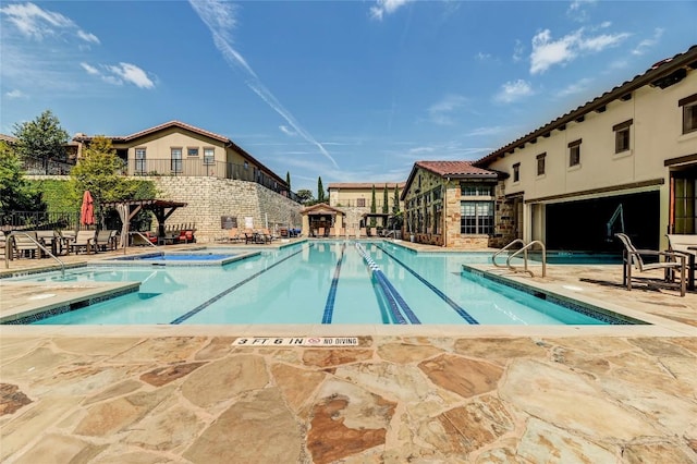 community pool with a patio area