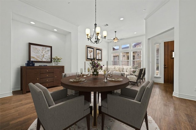 dining space with baseboards, visible vents, wood finished floors, and recessed lighting