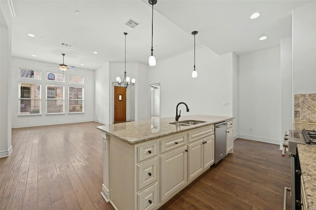 kitchen with stainless steel dishwasher, visible vents, dark wood finished floors, and a sink