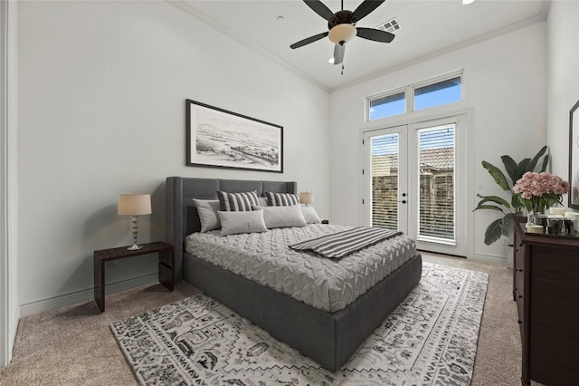 bedroom with light colored carpet, visible vents, access to outside, french doors, and ornamental molding