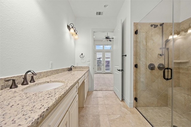 full bathroom with a shower stall, visible vents, a sink, and french doors