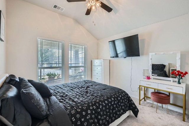 bedroom with vaulted ceiling, carpet floors, ceiling fan, and visible vents