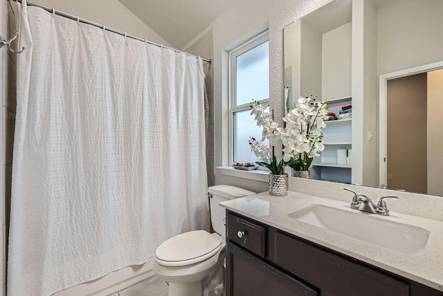 bathroom with lofted ceiling, shower / bath combo, vanity, and toilet