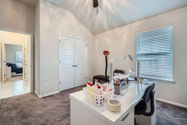 carpeted home office with vaulted ceiling, tile patterned flooring, and baseboards