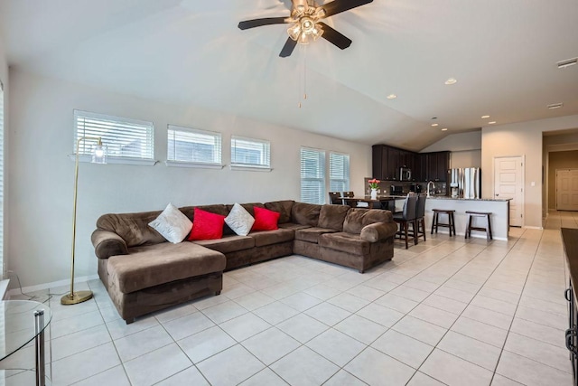 living room with light tile patterned floors, recessed lighting, a ceiling fan, baseboards, and vaulted ceiling