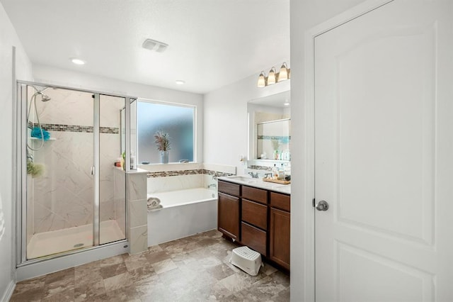 full bathroom with a stall shower, visible vents, a bath, and vanity