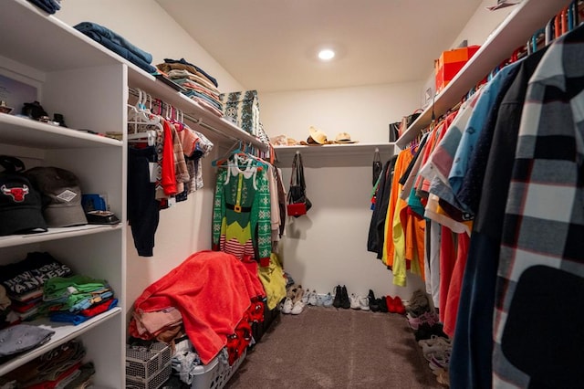 walk in closet with carpet flooring