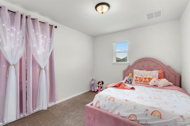 carpeted bedroom featuring visible vents