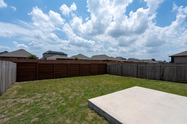 view of yard featuring a patio area and a fenced backyard