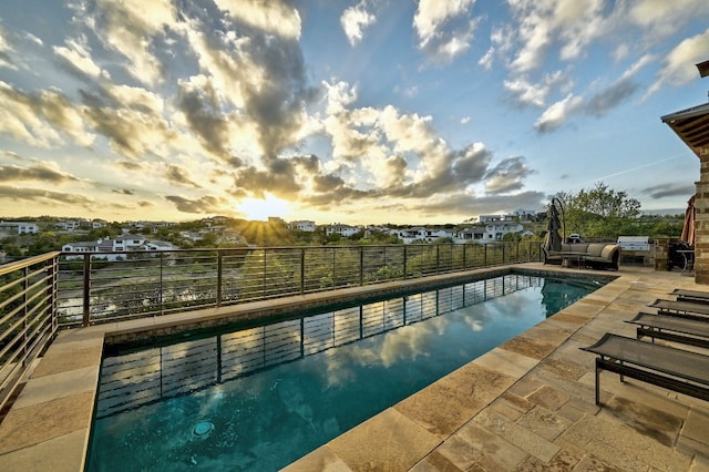 view of pool featuring fence, a fenced in pool, and a patio