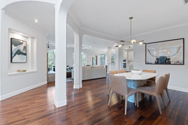 dining space featuring baseboards, dark wood-type flooring, arched walkways, and crown molding