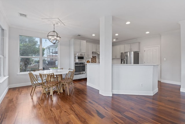 dining area featuring crown molding, visible vents, baseboards, dark wood finished floors, and an inviting chandelier