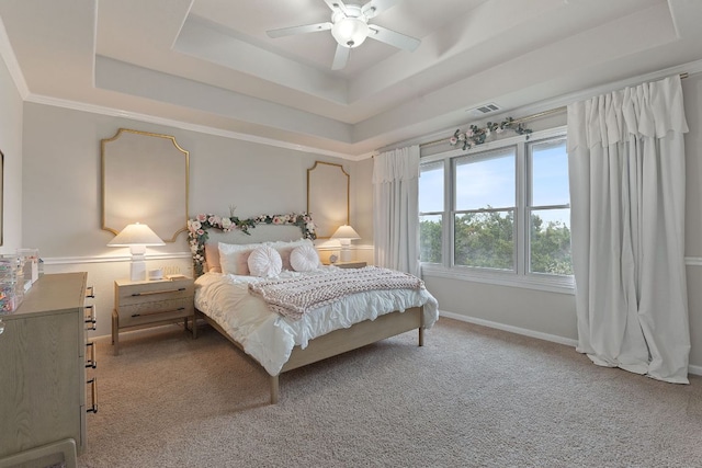 bedroom with baseboards, visible vents, a raised ceiling, ceiling fan, and carpet flooring