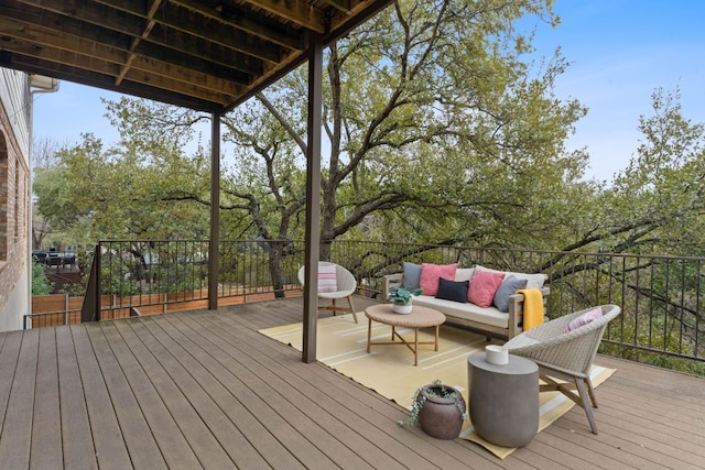 wooden terrace featuring an outdoor hangout area