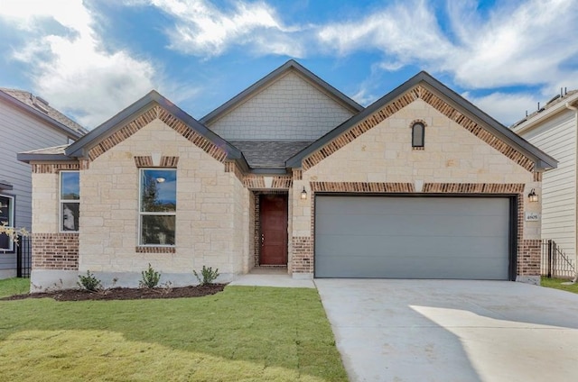 french provincial home featuring an attached garage, brick siding, a shingled roof, driveway, and a front yard