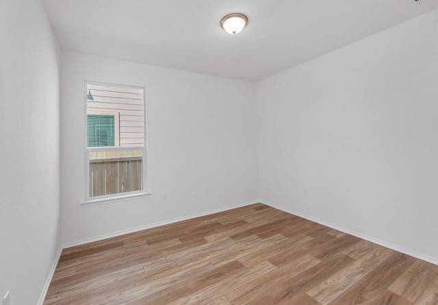 4805 Cressal Dr, Pflugerville, TX 78653 - spare room featuring wood finished floors and baseboards