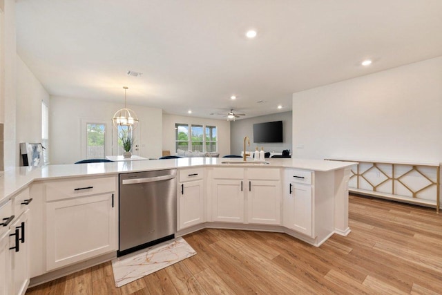 4805 Cressal Dr, Pflugerville, TX 78653 - kitchen with dishwasher, a sink, light wood-style flooring, light countertops, and recessed lighting