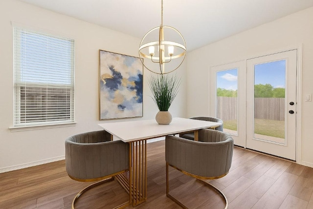 4805 Cressal Dr, Pflugerville, TX 78653 - dining room with wood finished floors, baseboards, and a desk