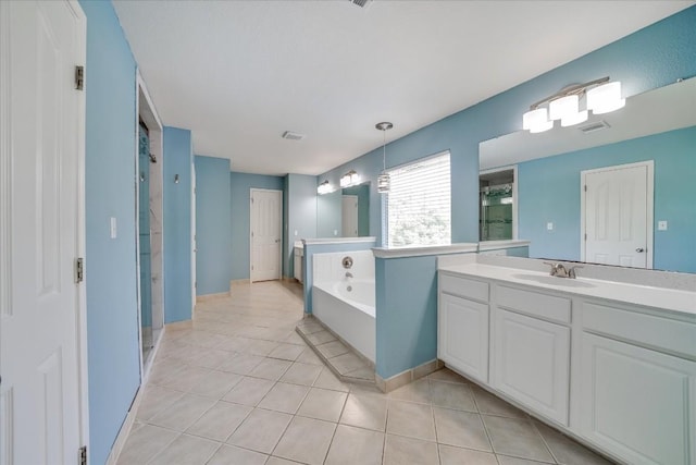 full bathroom featuring a stall shower, tile patterned flooring, visible vents, and vanity