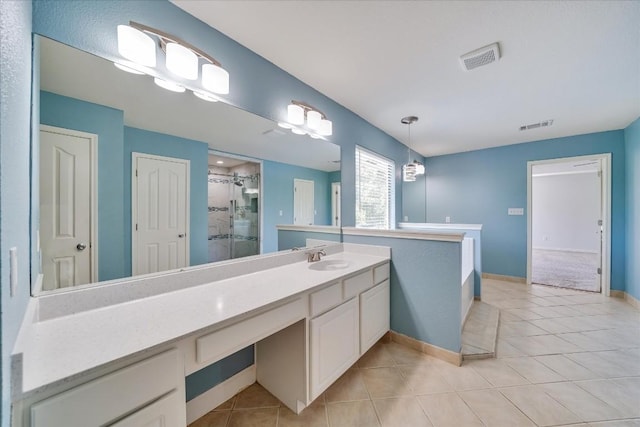 full bath featuring a shower stall, vanity, visible vents, and tile patterned floors