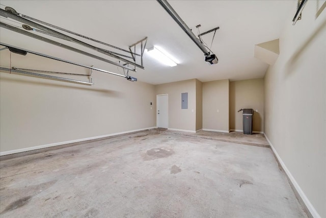 garage with electric panel, baseboards, and a garage door opener