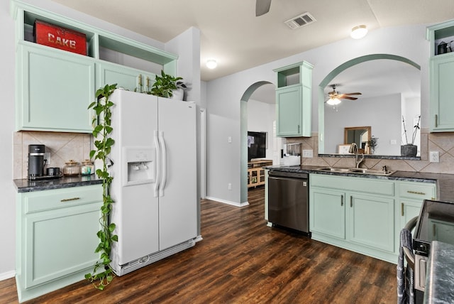 kitchen with white refrigerator with ice dispenser, black electric range oven, visible vents, stainless steel dishwasher, and a ceiling fan