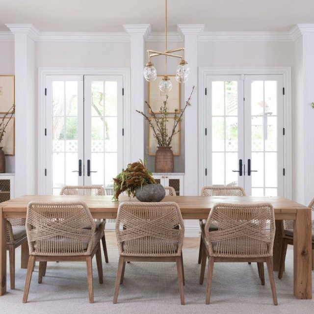 dining room featuring french doors and crown molding