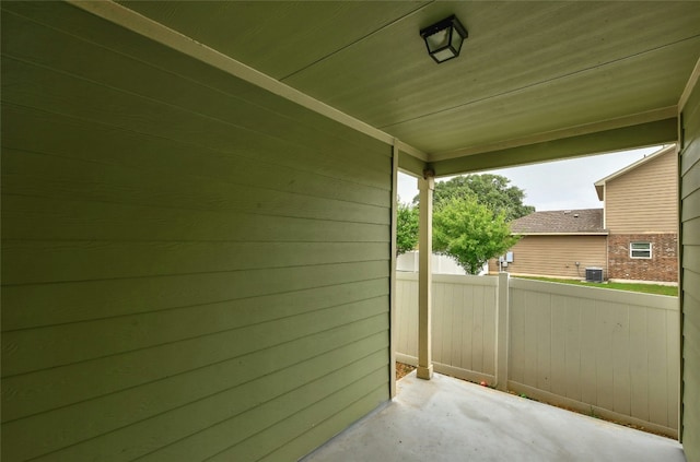 view of patio with fence and central AC