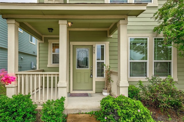 doorway to property with covered porch