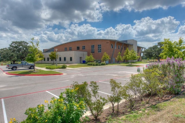 view of property featuring uncovered parking