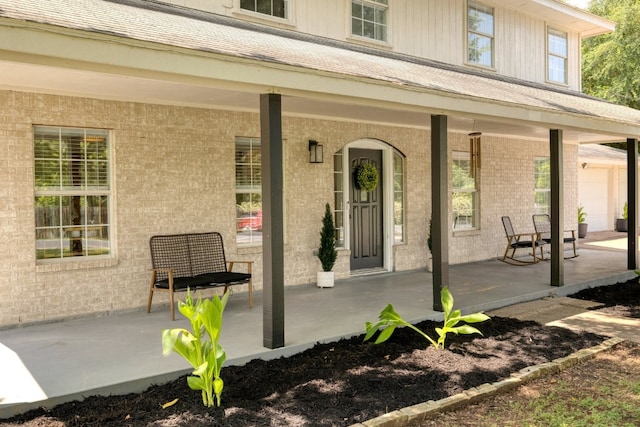 entrance to property featuring covered porch