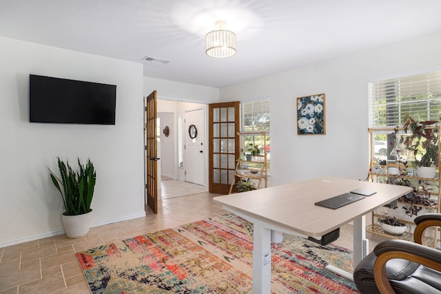 home office featuring visible vents and baseboards