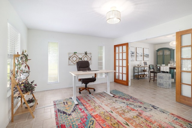 home office with french doors and baseboards