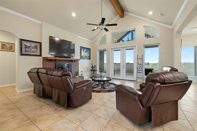 living room featuring french doors, visible vents, a fireplace, and beamed ceiling