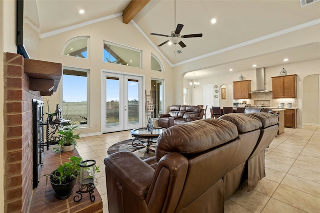 living area featuring arched walkways, beam ceiling, a fireplace, light tile patterned flooring, and high vaulted ceiling