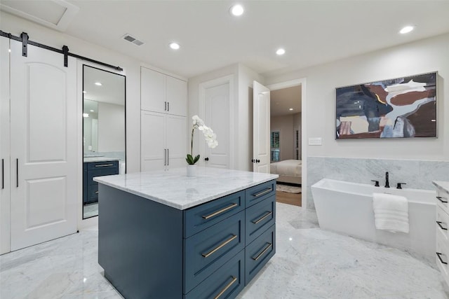 full bathroom featuring recessed lighting, vanity, visible vents, marble finish floor, and ensuite bath