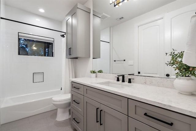 full bath featuring visible vents, toilet, tile patterned floors, shower / bath combo with shower curtain, and vanity