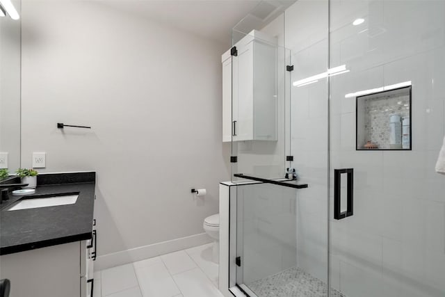 full bath with toilet, vanity, baseboards, a shower stall, and tile patterned floors