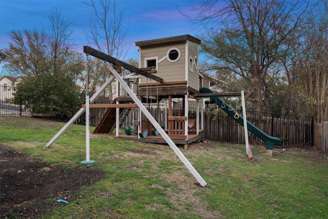 view of play area with a lawn and a fenced backyard