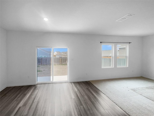 128 Gauntlet Dr, Jarrell, TX 76537 - empty room featuring wood finished floors and recessed lighting