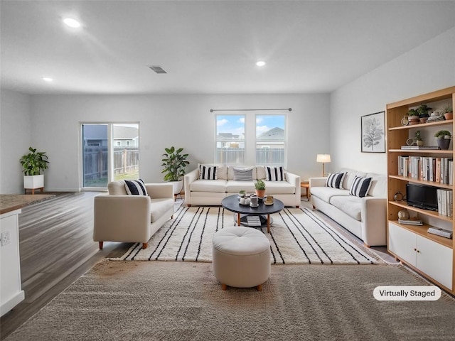 128 Gauntlet Dr, Jarrell, TX 76537 - living area featuring wood finished floors and recessed lighting