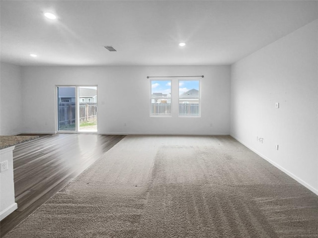 128 Gauntlet Dr, Jarrell, TX 76537 - empty room with recessed lighting, healthy amount of natural light, and wood finished floors