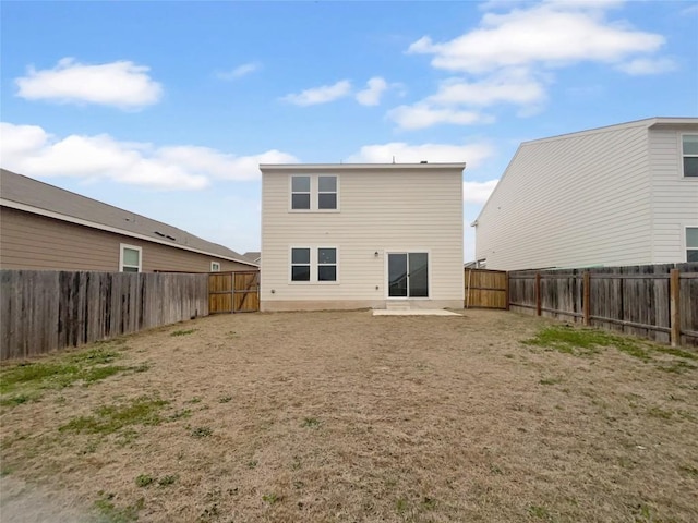 128 Gauntlet Dr, Jarrell, TX 76537 - rear view of house featuring a fenced backyard