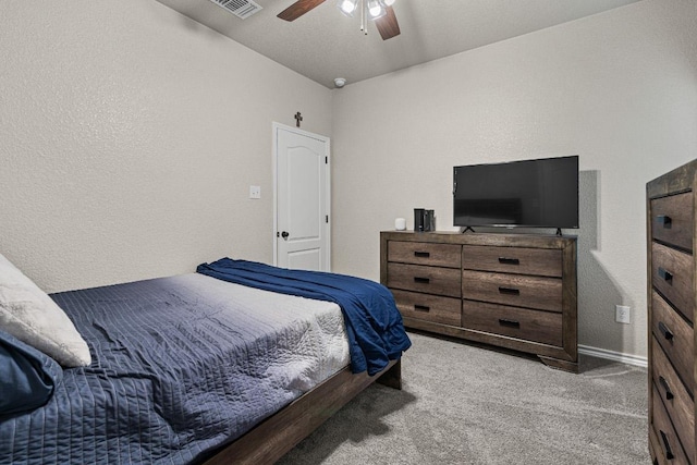 bedroom with ceiling fan, carpet flooring, and visible vents