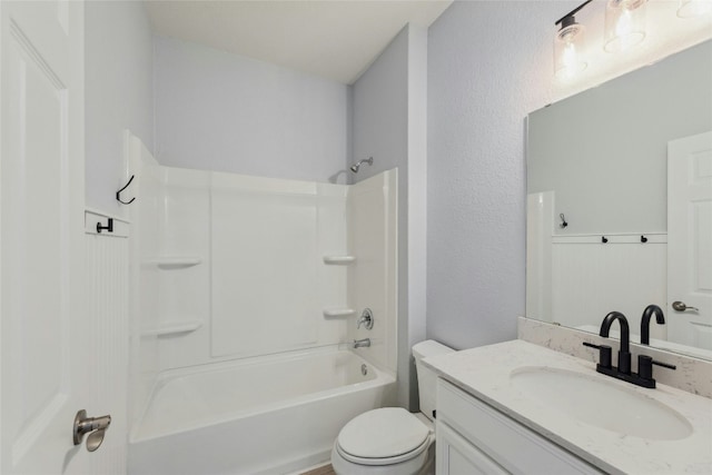 full bathroom featuring bathing tub / shower combination, vanity, and toilet