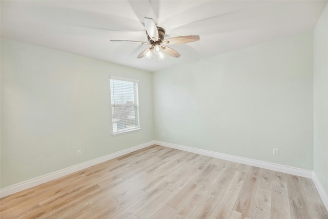 unfurnished room featuring baseboards, ceiling fan, and light wood finished floors